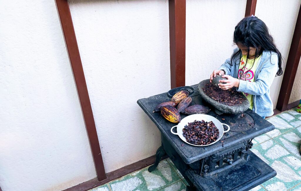 Things to do in La Fortuna - Grinding Cocoa beans at the coffee and chocolate tour