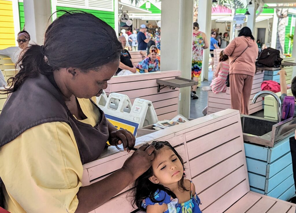 Walking tour of Nassau - Kids getting their hair braided near the Cruise Terminal in Nassau, Bahamas