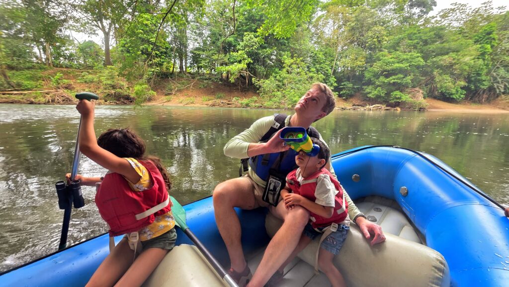 Things to do in La Fortuna - Searching for monkeys in the tree tops during the safari float
