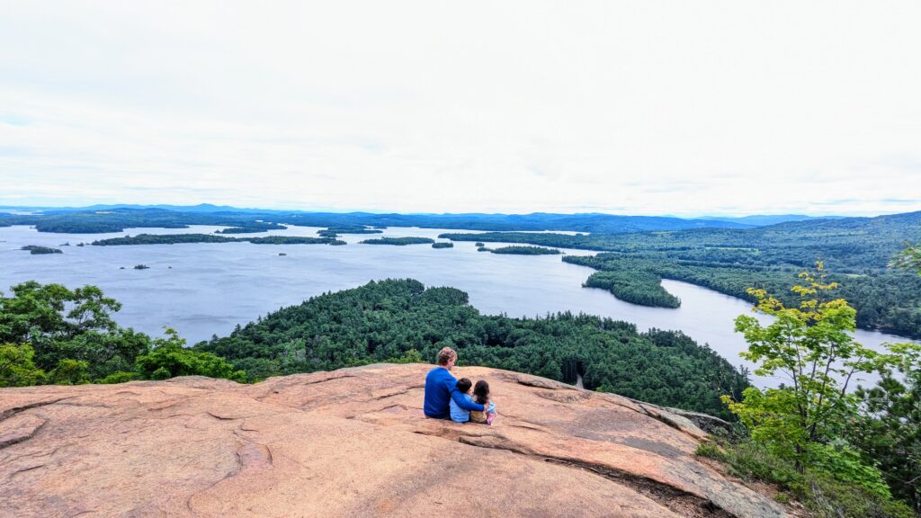 New Hampshire with Kids - Admiring the view of Squam Lakes at the top of West Rattlesnake Mountain