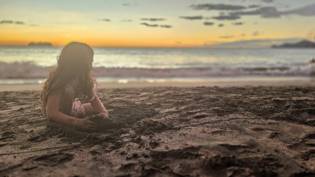 Kids enjoying the sunset at Playa Hermosa beach