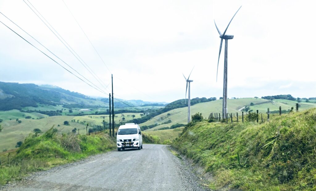 A private shuttle driving on the gravel road to Monteverde