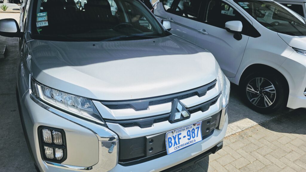 Do you need a car in Costa Rica - Rental cars lined up with Costa Rica license plates